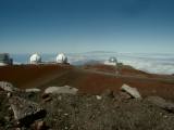 Twin white Keck domes seem to peer across the A Straight toward Maui from atop Mauna Kea, the highest point in the Pacific Basin